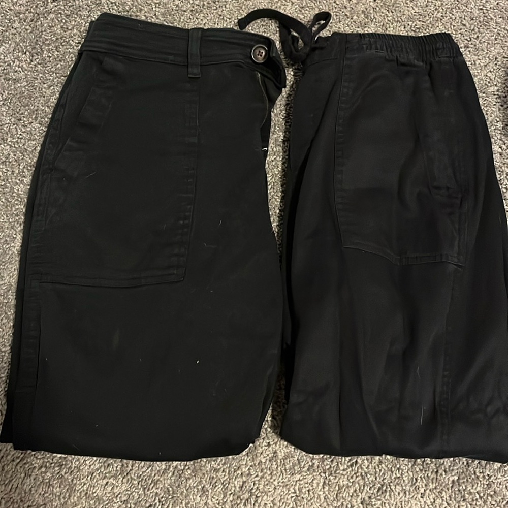 two pairs of black dress pants